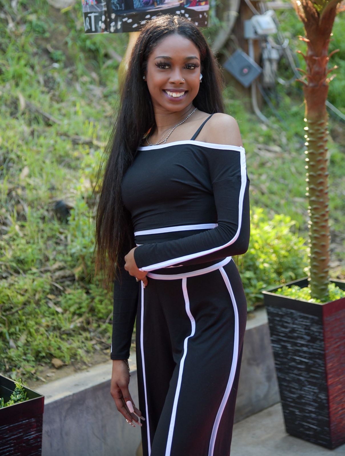 A Stripchat House Hollywood cast member arrives on the red carpet outside the Hollywood Hills mansion