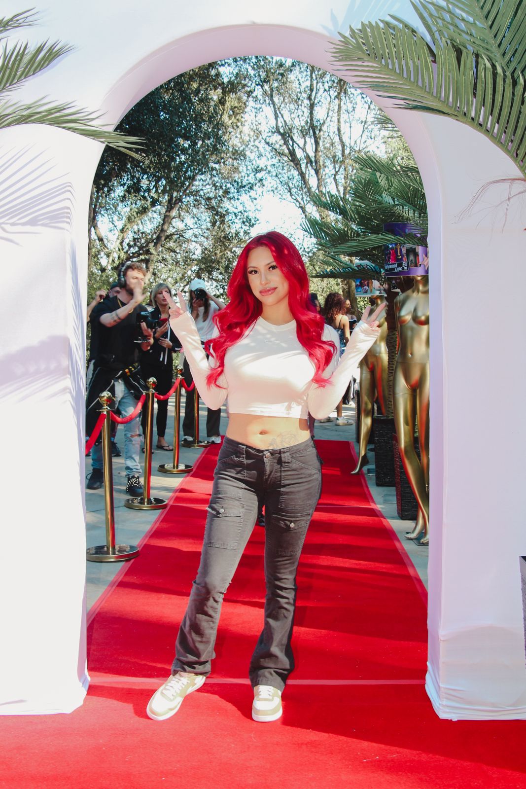 A Stripchat House Hollywood cast member arrives on the red carpet outside the Hollywood Hills mansion