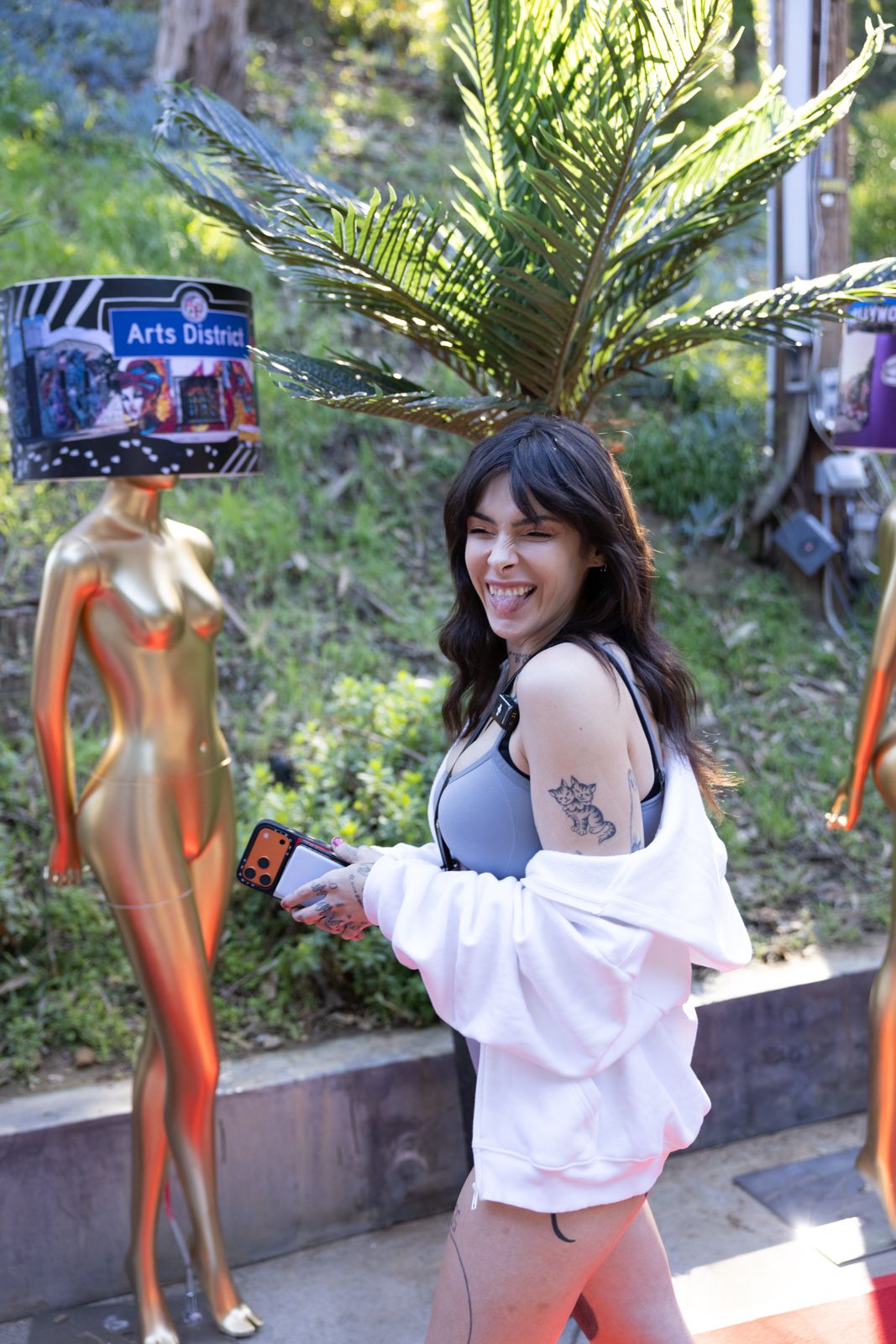 A Stripchat House Hollywood cast member arrives on the red carpet outside the Hollywood Hills mansion