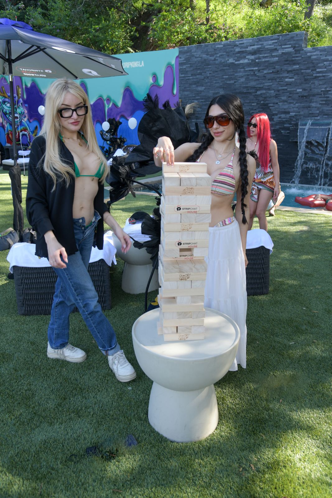 Cast members relaxing around the Stripchat House Hollywood mansion between shoots