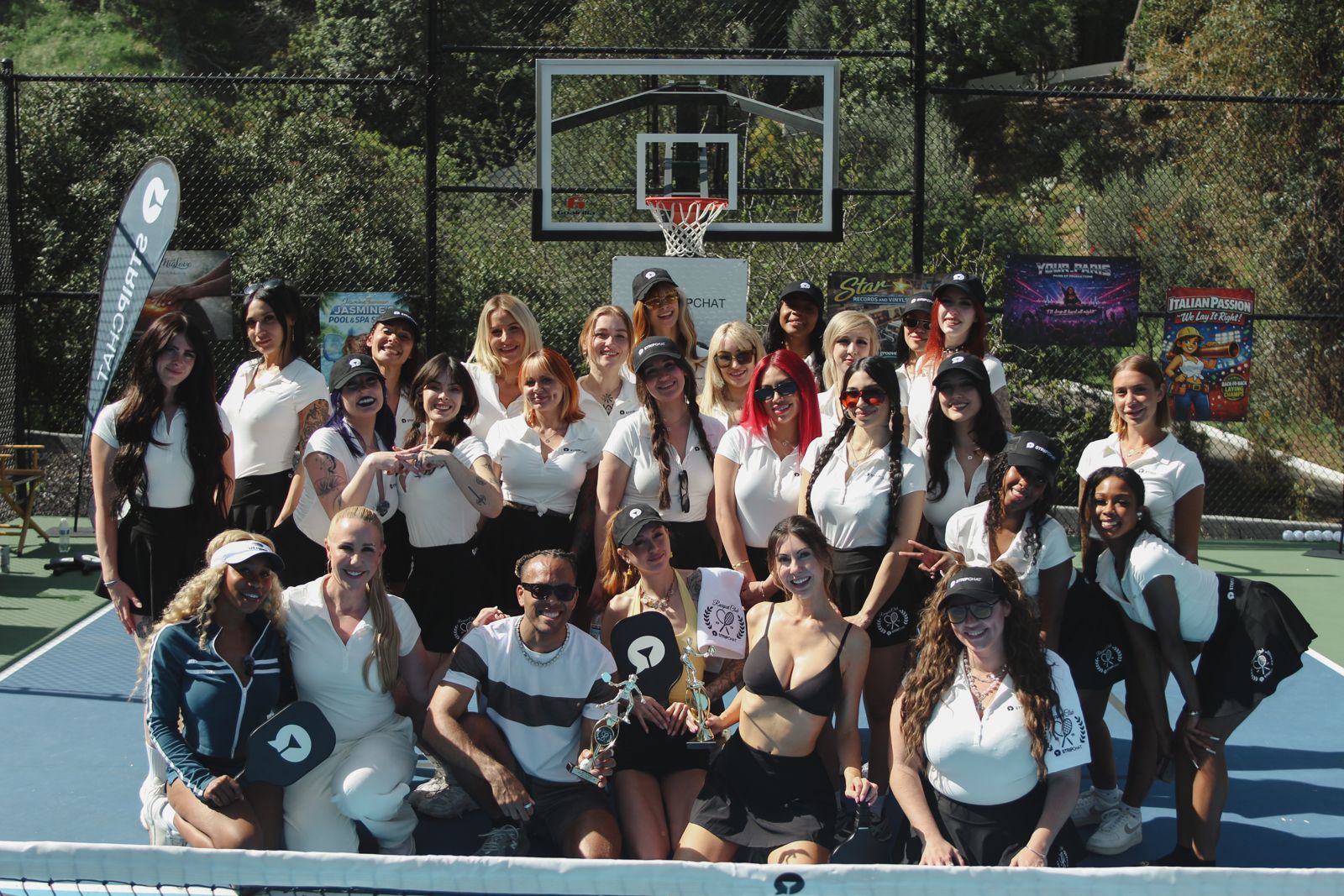 Stripchat House cast members in racquet club uniforms at the house pickleball tournament