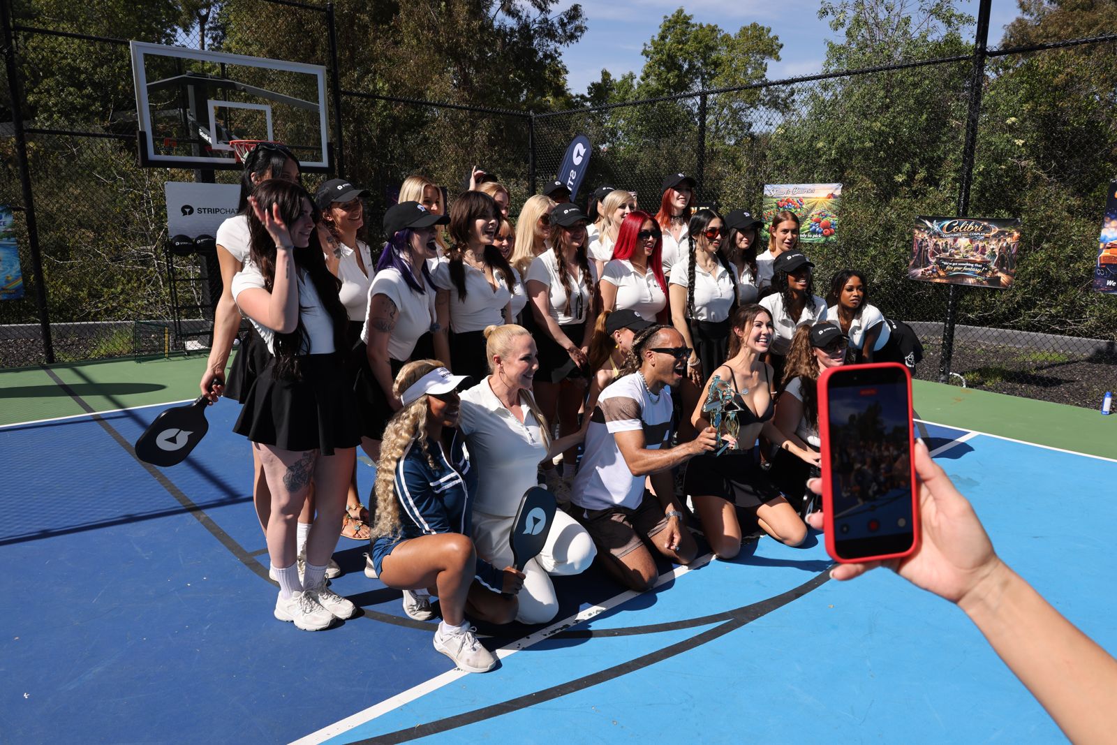 Tournament winners with their trophies at the Stripchat House pickleball day