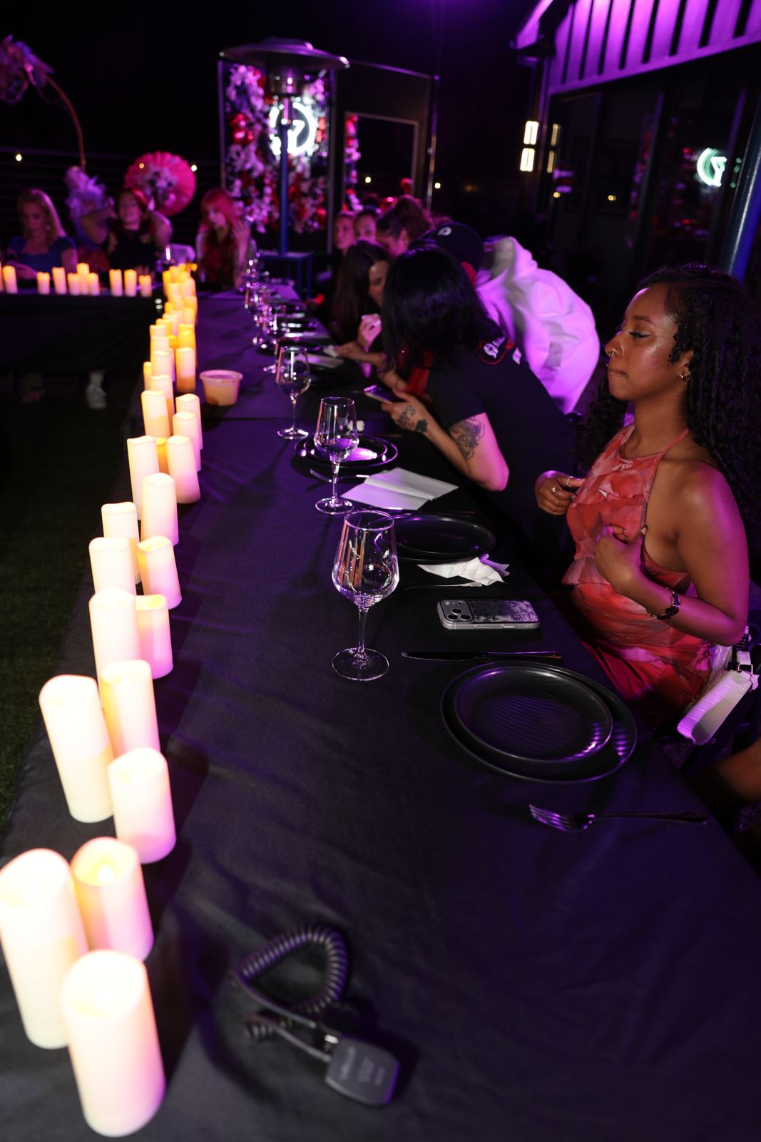 The candle-lit hibachi dinner table at the Stripchat House Hollywood
