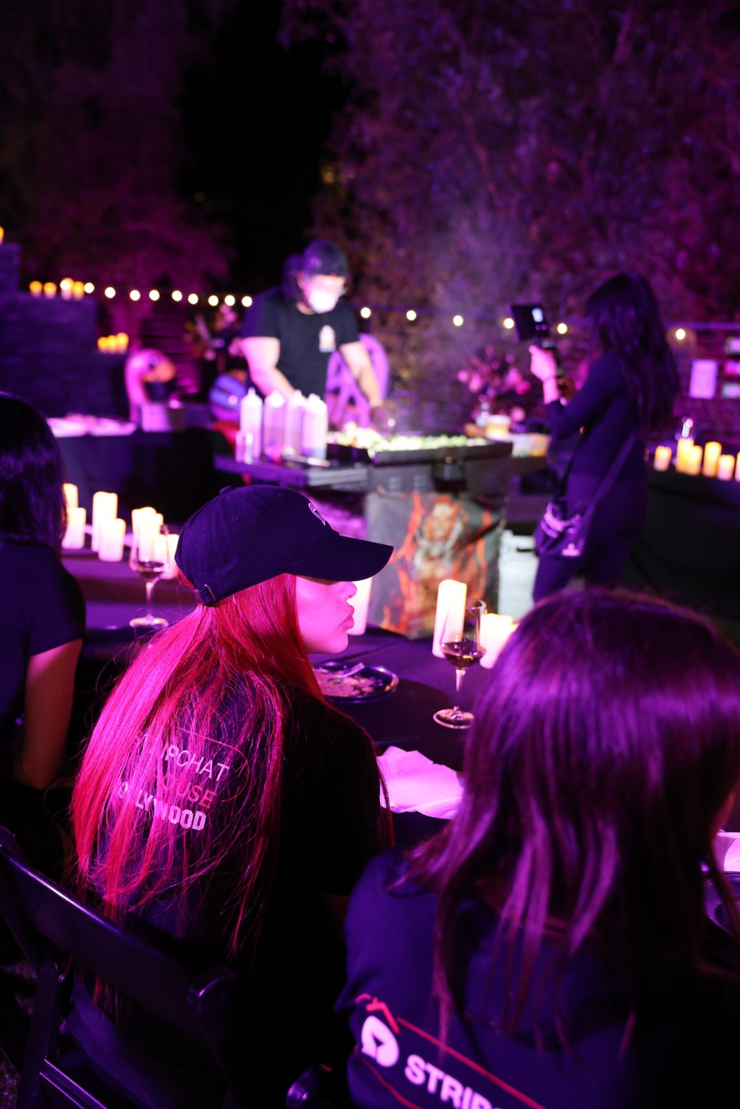 The candle-lit hibachi dinner table at the Stripchat House Hollywood