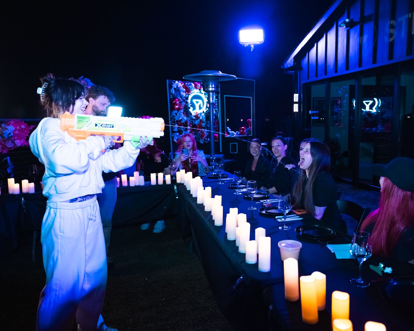 The candle-lit hibachi dinner table at the Stripchat House Hollywood