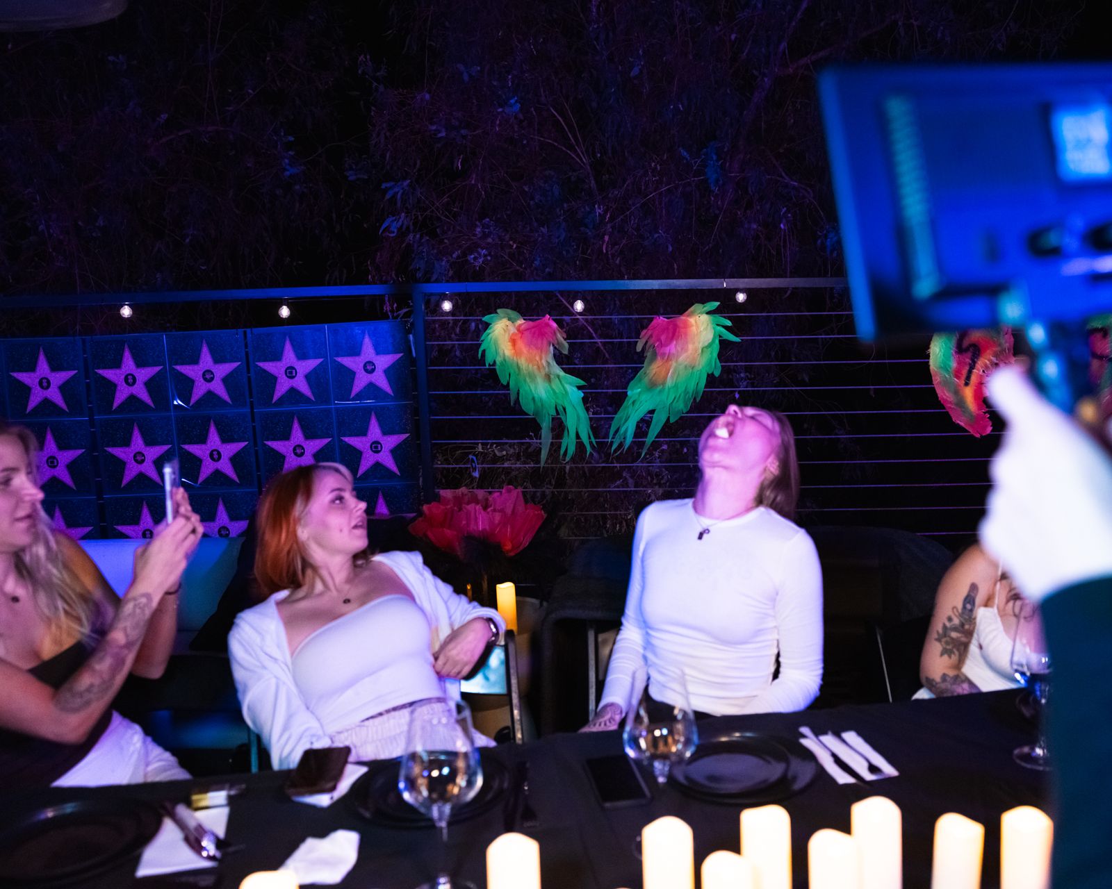 The candle-lit hibachi dinner table at the Stripchat House Hollywood