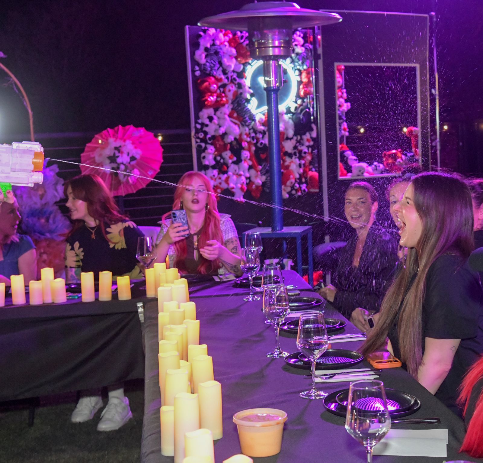 The candle-lit hibachi dinner table at the Stripchat House Hollywood