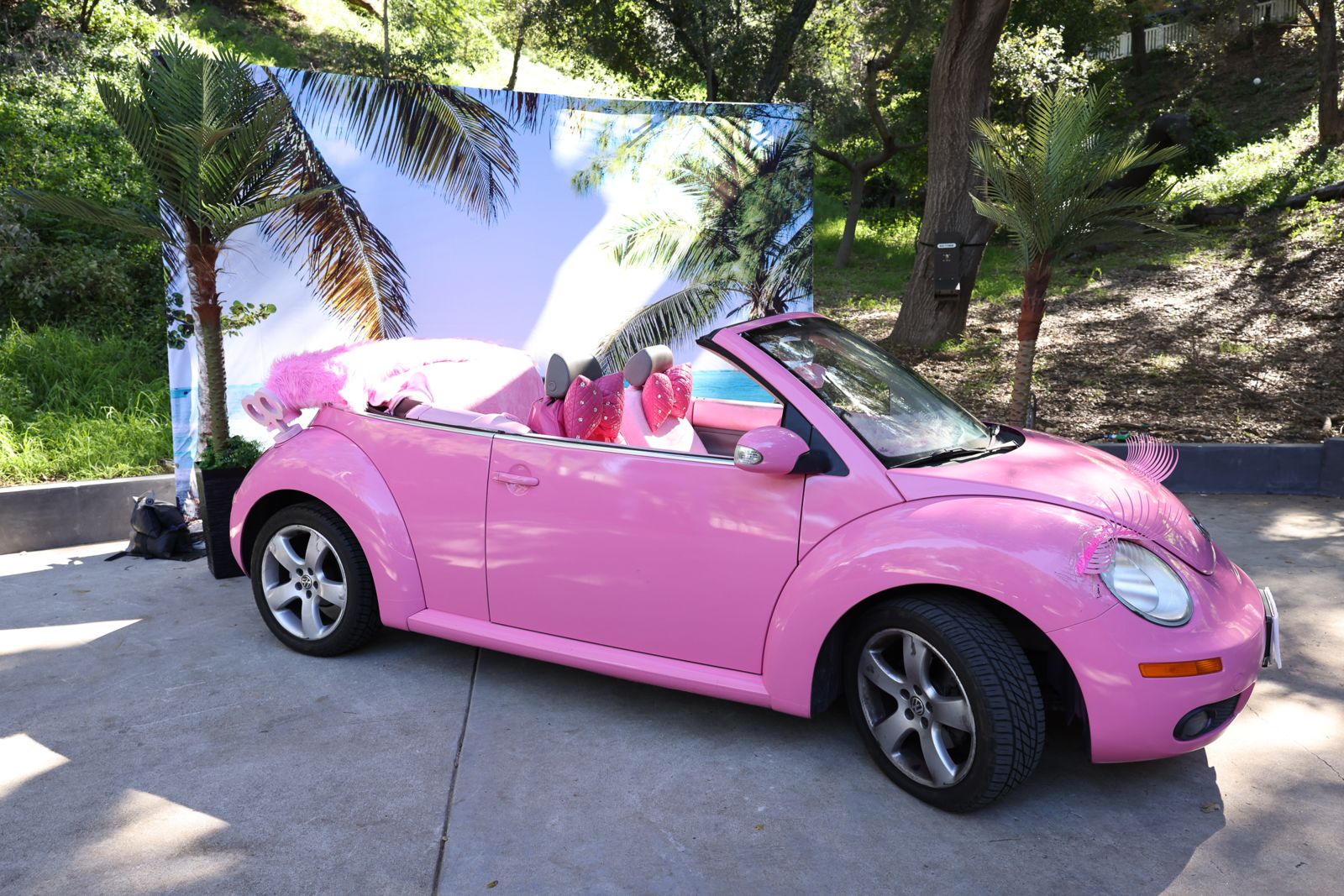 The pink Volkswagen Beetle from the Barbie shoot parked outside the Stripchat House Hollywood