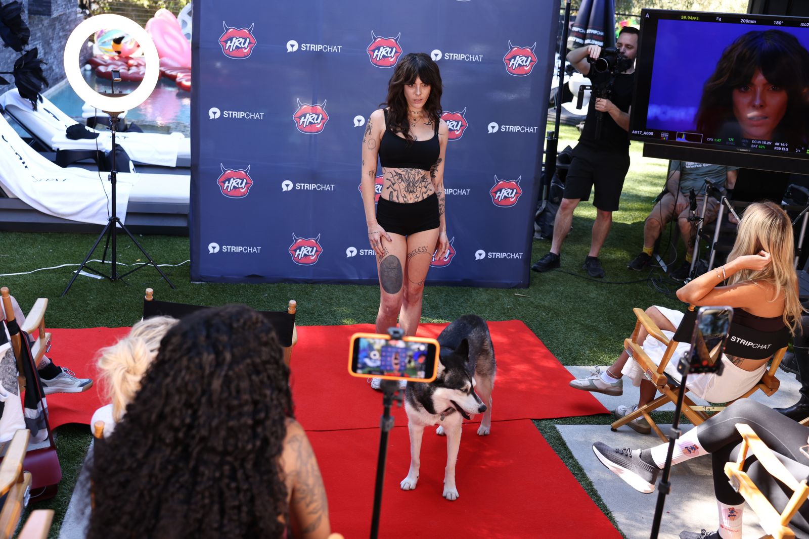 A cast member walks the practice runway during media training at the Stripchat House