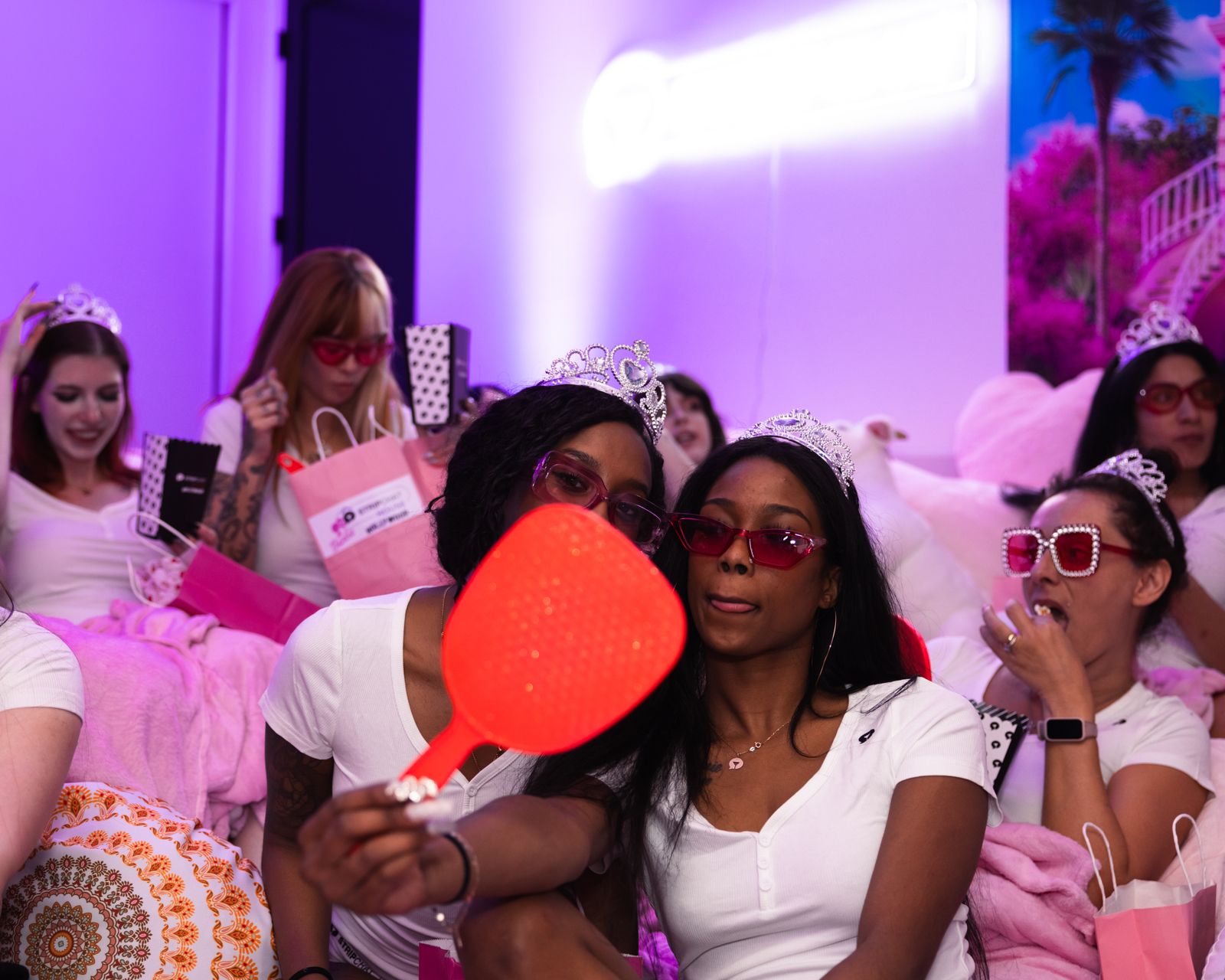 The Barbie-themed slumber party in the pink room at the Stripchat House, tiaras and gift bags included