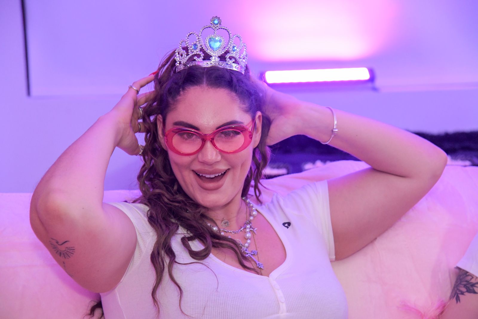 The Barbie-themed slumber party in the pink room at the Stripchat House, tiaras and gift bags included