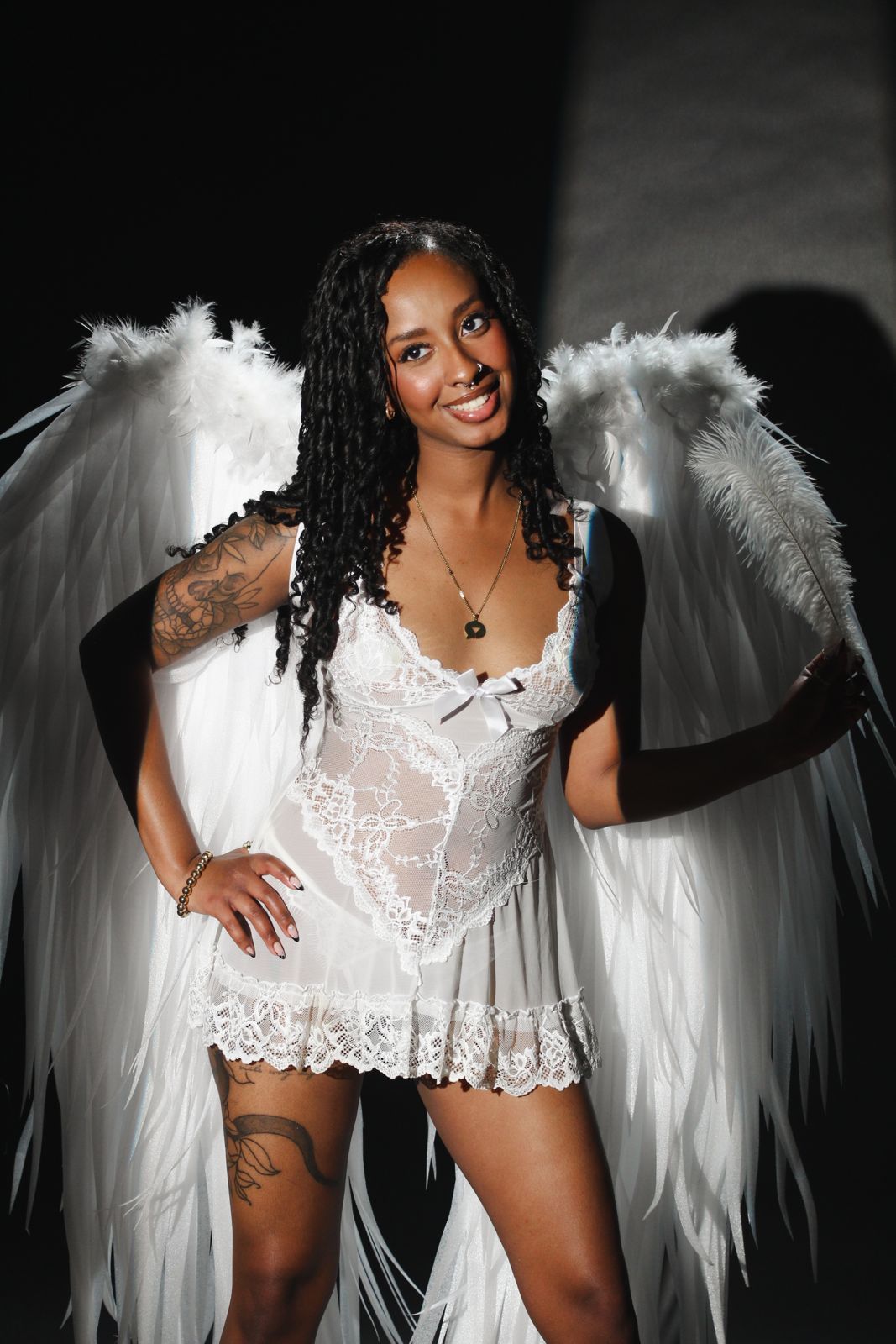 A cast member in angel wings during the editorial photoshoot at the Stripchat House Hollywood