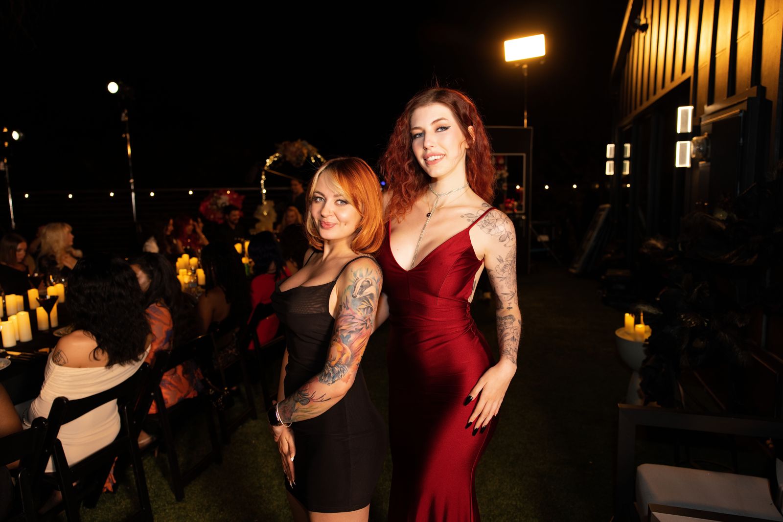 The candle-lit fine-dining dinner in the Stripchat House backyard, cast in evening wear