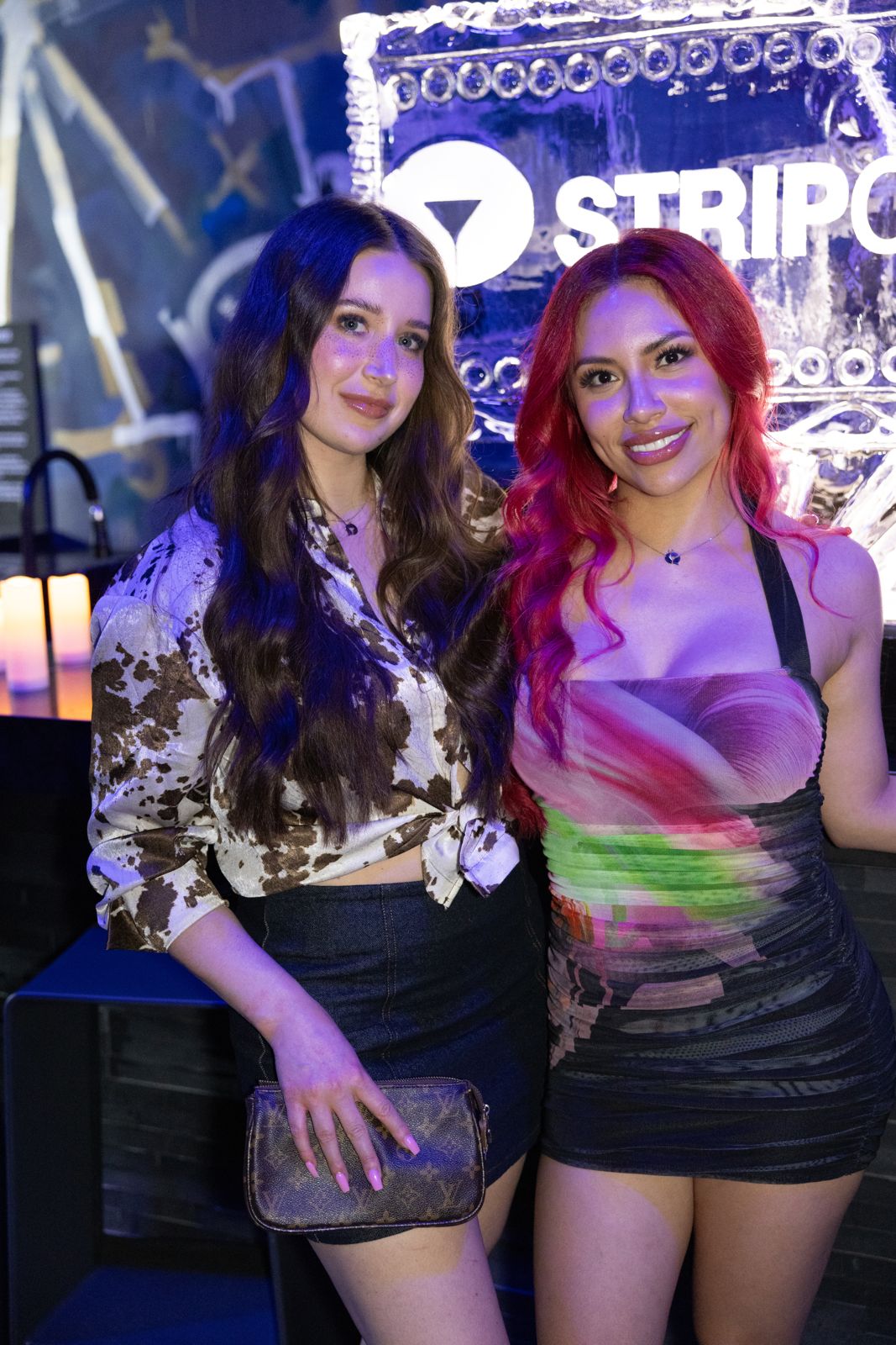 Guests on the Stripchat House Hollywood and Wet Ink magazine step-and-repeat wall at the launch party