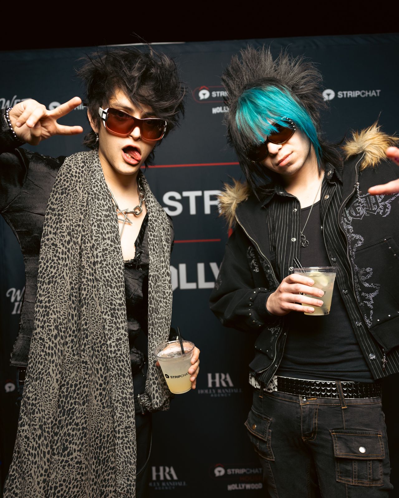 Guests on the Stripchat House Hollywood and Wet Ink magazine step-and-repeat wall at the launch party