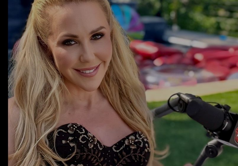 Holly Randall on the mic at the outdoor podcast set